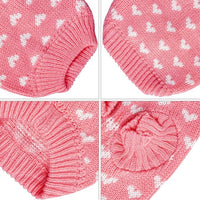 Small dog knitted sweater in pink with heart design, ideal for cold weather.