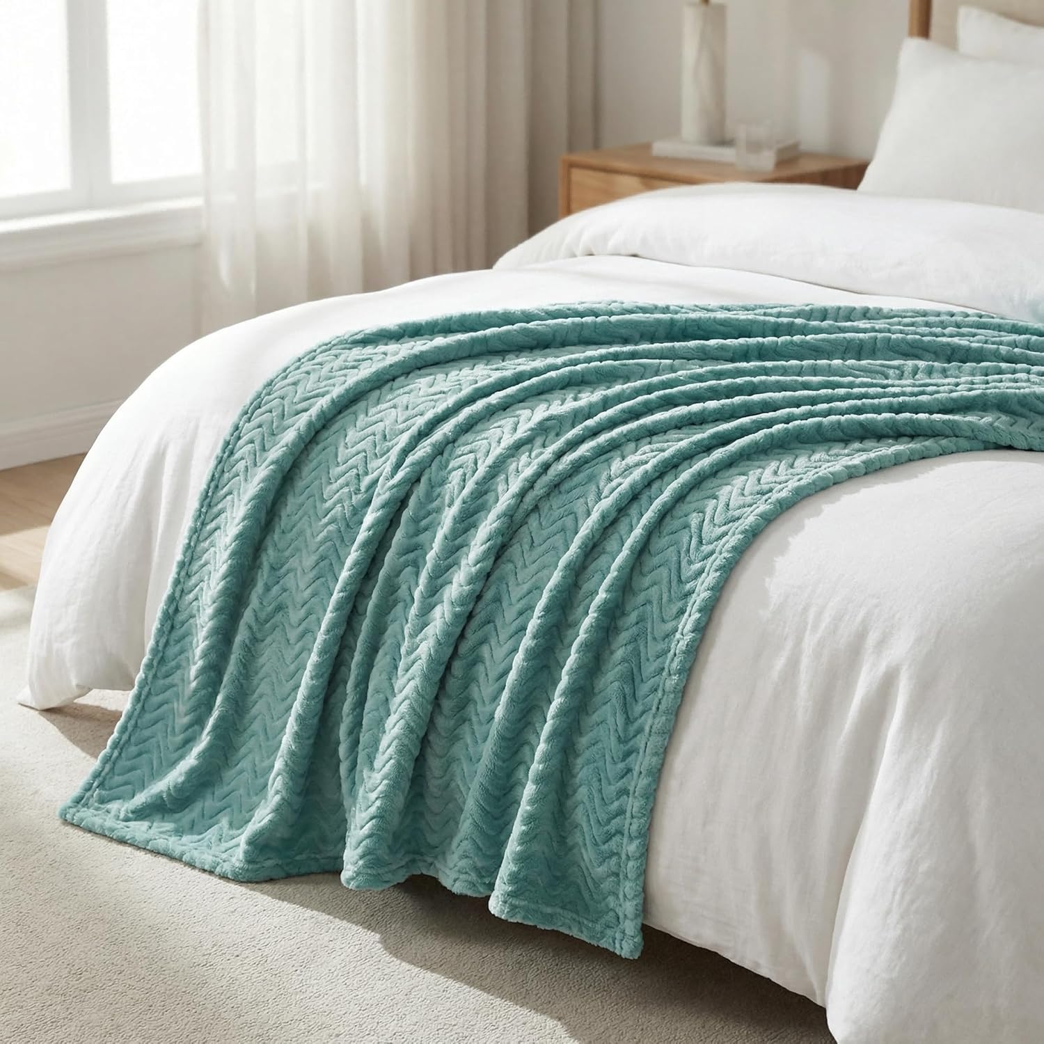 Plush microfiber throw blanket on modern sofa