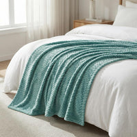 Plush microfiber throw blanket on modern sofa