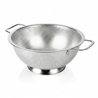 Metal kitchen strainer draining pasta and vegetables