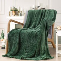 Green plush fleece blanket on living room couch