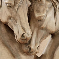 Close view showing the textured finish and warm neutral shading of the sculpture