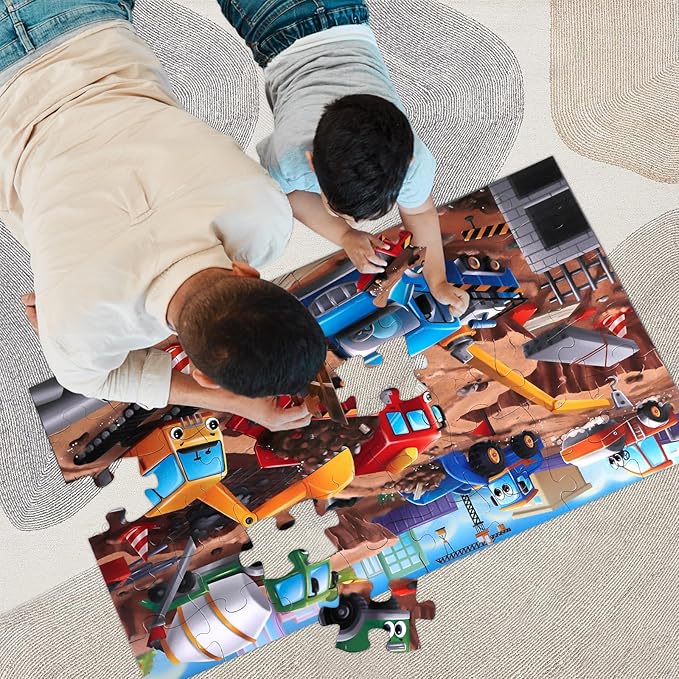 Two children playing with a train-themed puzzle on a large mat.