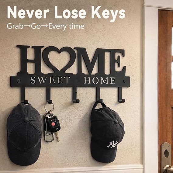 Key holder with 'HOME SWEET HOME' text on a wall with caps and keys attached.