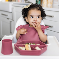 Side View of Wipeable Toddler Bib with Catch-All Pocket