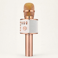 Wireless karaoke microphone in rose gold with built in speaker