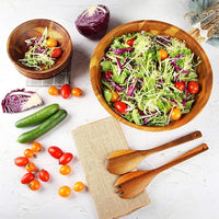 Acacia wood serving bowl filled with fresh fruit