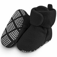  Hook-and-loop strap positioned around the plush ankle opening.