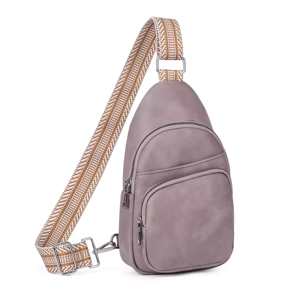 Adjustable guitar-style strap on vegan leather sling bag