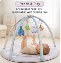 Round baby activity mat with crossed arches top view