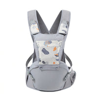 Parent wearing a blue baby carrier during a supervised outdoor walk