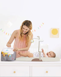 Baby changing pad with coordinated diaper-changing essentials for nursery use
