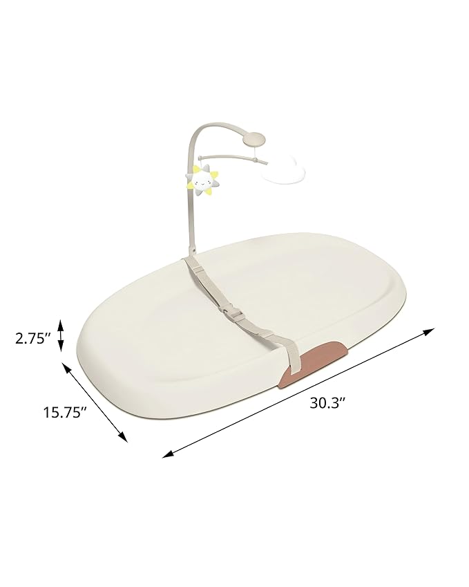 Close up of the integrated tuck-away toy bar on a foam changing pad