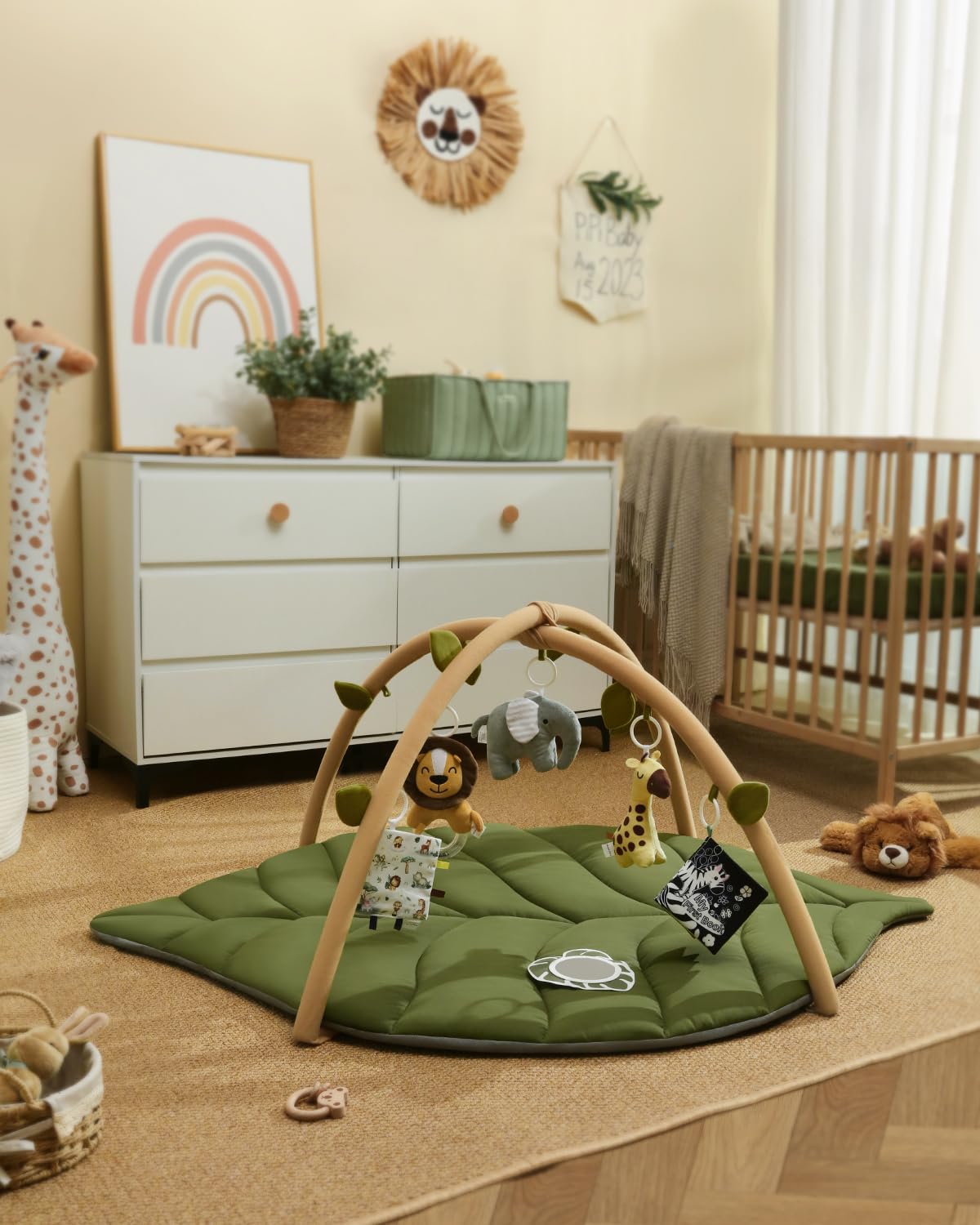 Green padded baby floor play mat for supervised tummy time