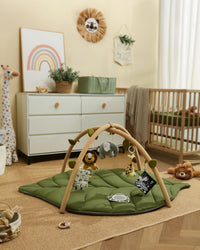 Green padded baby floor play mat for supervised tummy time