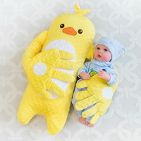 Baby patting pillow with soothing moving hand