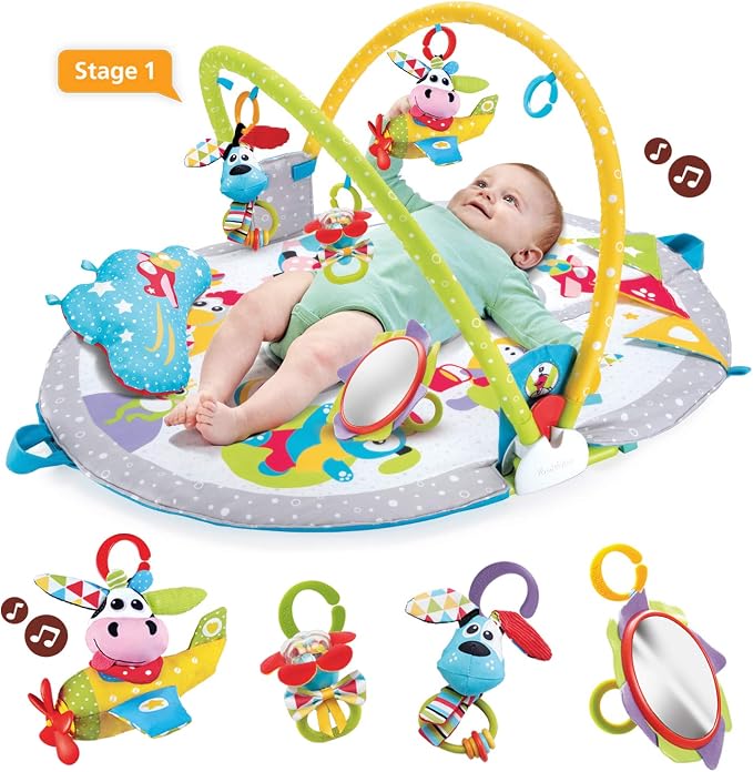 Baby lying on activity play gym with overhead toys