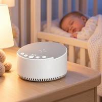 Parent preparing a baby's bedtime routine with a tabletop audio machine