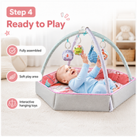 Padded baby tummy time play gym with overhead arches