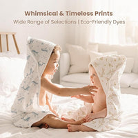 Infant wrapped in ultra soft muslin hooded towel after bath