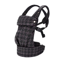 Detailed view of the infant carrier's fastening mechanism and connecting straps.