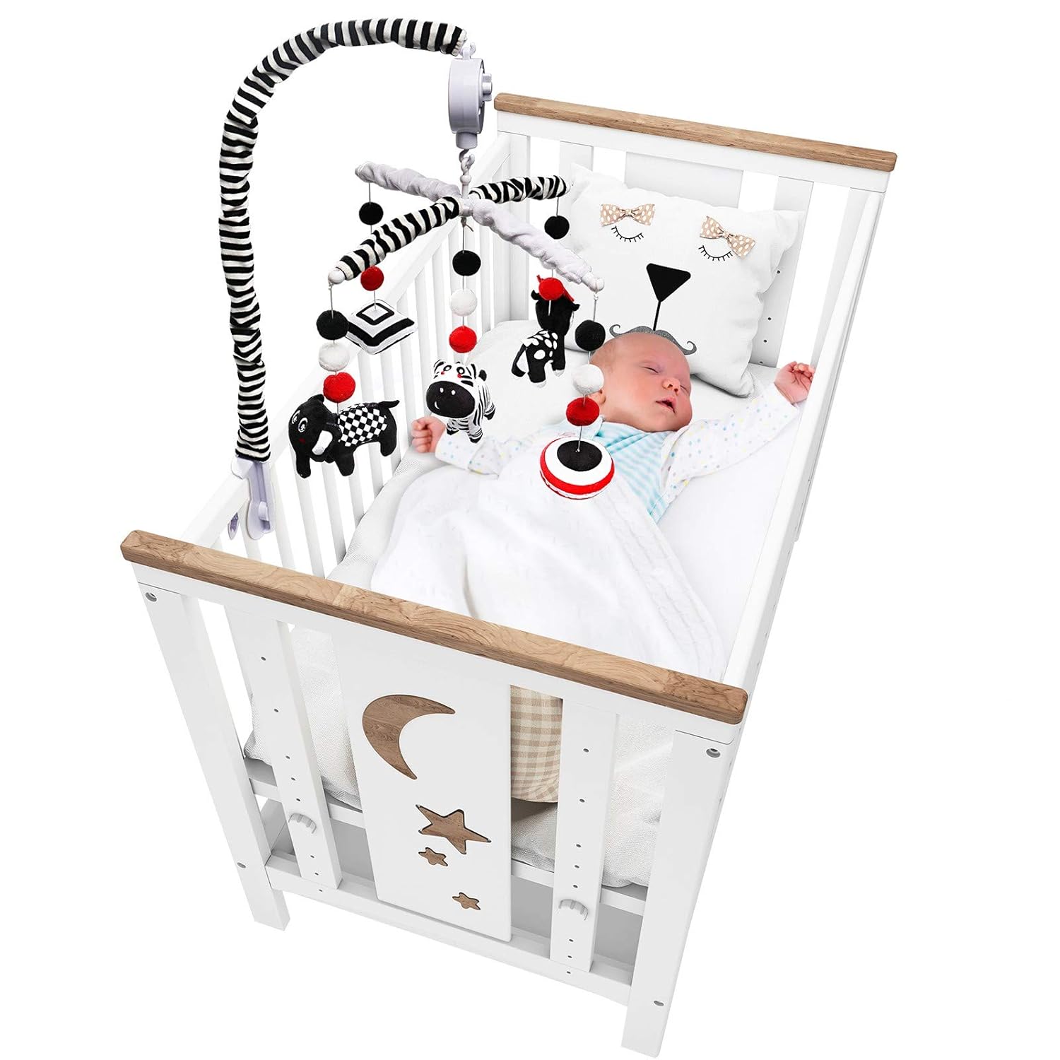 Black and white baby mobile installed above nursery crib