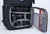 Camera backpack with polyester lined interior and organized storage sections