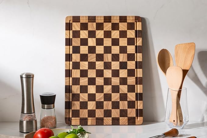 Checkered cutting board featuring an edge juice groove