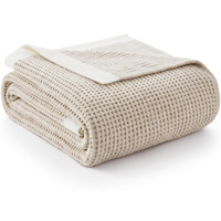 Soft beige chenille throw blanket with waffle knit texture for couch and sofa