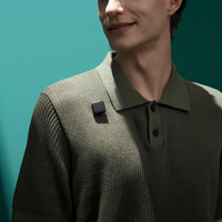 clip on mini microphone transmitter attached to clothing for hands free recording