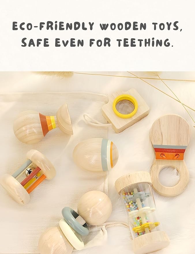 Colorful wooden baby rattles arranged together on a plain background