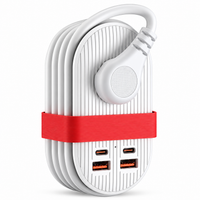 Purple desktop charging accessory displayed beside compatible electronics.