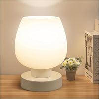 Compact bedroom table lamp illuminating bedside space