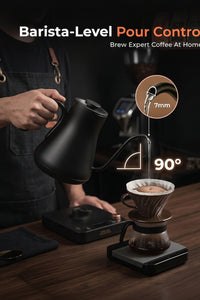 Cordless black gooseneck kettle positioned on its power base