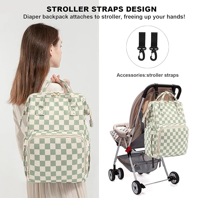 Checkered diaper bag hanging from a stroller handle using integrated straps