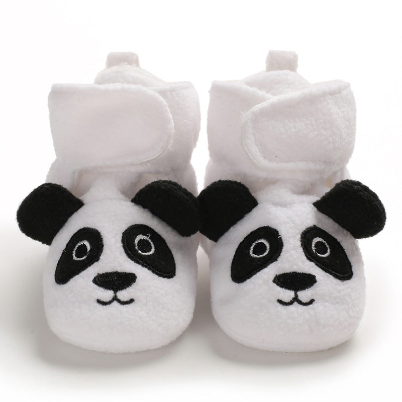 Overhead view of matching infant shoes with rounded toes and folded collars.