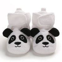 Overhead view of matching infant shoes with rounded toes and folded collars.