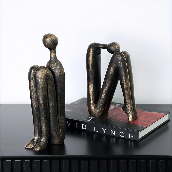 Decorative Book Holders Keeping Books Upright On A Modern Bookshelf
