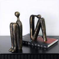 Decorative Book Holders Keeping Books Upright On A Modern Bookshelf