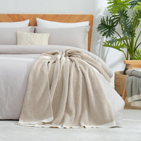Decorative beige throw blanket for living room styling