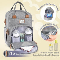 Open front compartment of diaper bag showing three insulated foil-lined bottle holders