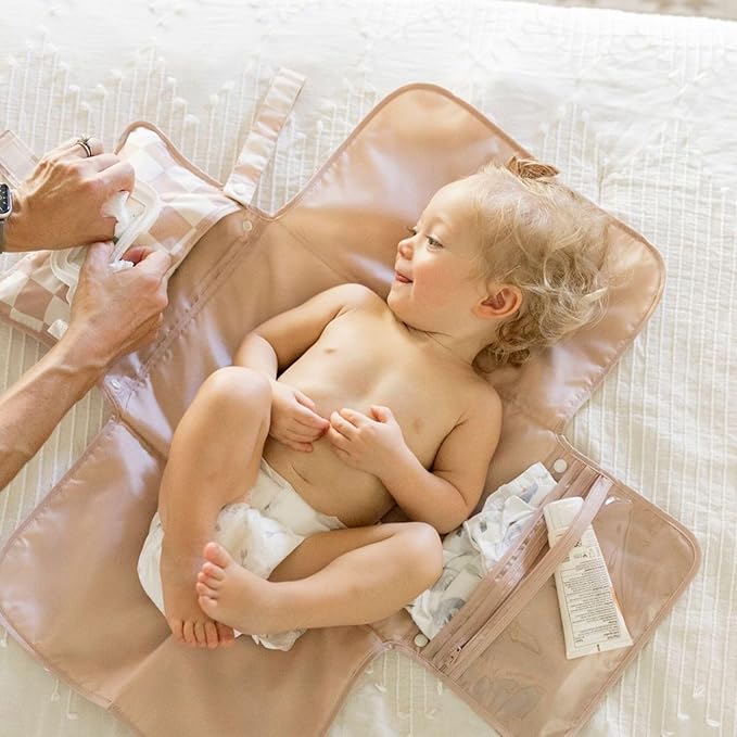 Interior view showing mesh pockets filled with diapers and baby cream