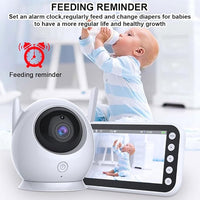Portable infant monitor showing a smiling baby on its LCD screen