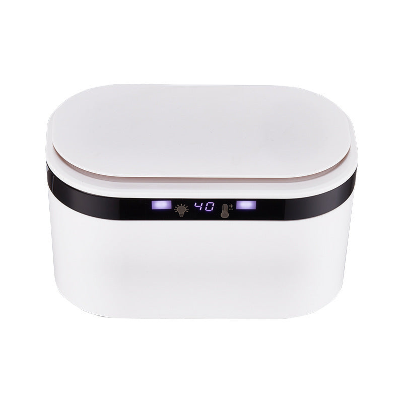 White electric baby wipe warmer with a black digital temperature display.