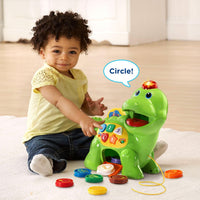 Dinosaur feeding toy for toddlers with interactive counting activities.