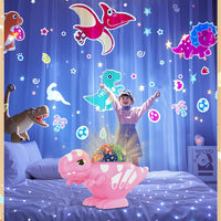 Dinosaur projector showing colourful star lights projected onto a bedroom wall and ceiling.