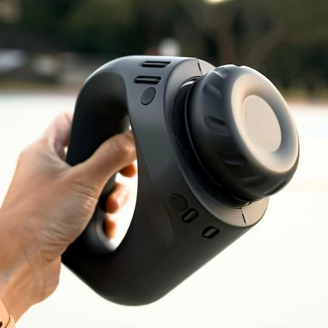 Electric handheld massager being used gently on the scalp