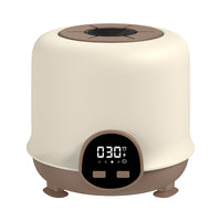 Electric baby bottle warmer with digital display and compact countertop design
