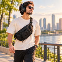 Everyday travel essentials featuring a sling bag, headphones and portable charger