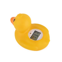 Baby bath thermometer floating on water showing temperature reading